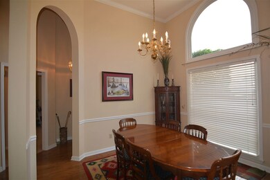 Beautiful hardwood floors lead from entryway into 