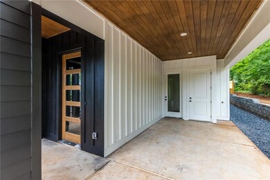 Property entrance with a patio area