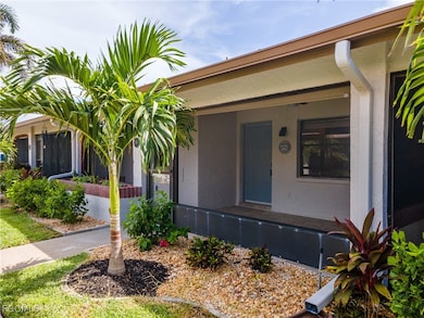 Doorway to property with stucco siding