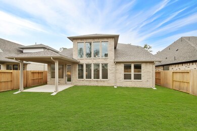 Large backyard with covered patio excellent for outdoor fun!