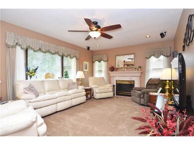 Family Room. ENTERTAIN BY THE WARMTH OF THE FIREPL