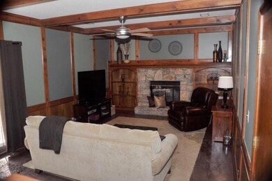 Great Room with Stone Fireplace and Built-In Books