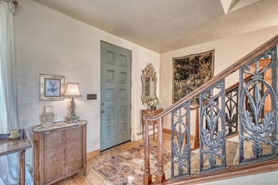 On the other side of the yellow front door.