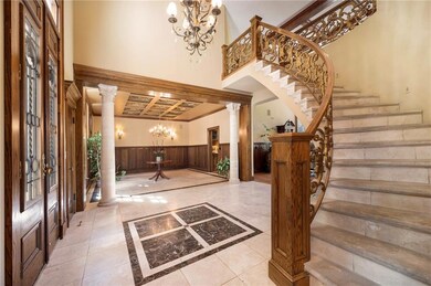 Grand Entry with curved staircase, 10' tall Victorian doors out of the Presidential Hotel