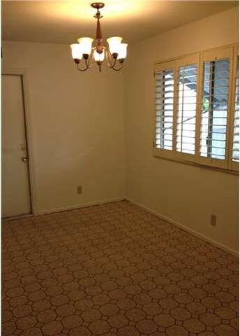 Large dining area with direct garage access is ope