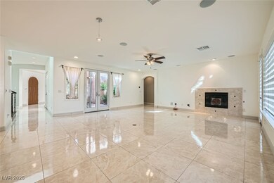 Unfurnished living room with arched walkways, base