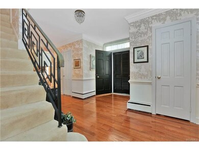 Foyer, view 2.  Walk-in coat closet behind door on