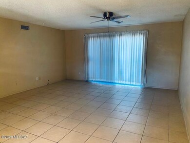 Tiled living room with patio door