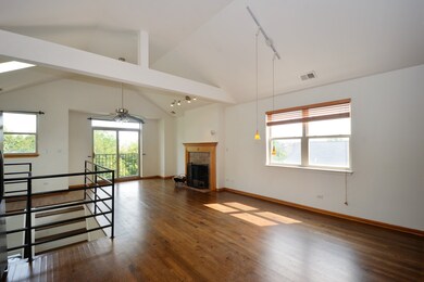Vaulted ceilings, beams and skylights create a dra