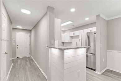 Kitchen featuring stainless steel refrigerator, or