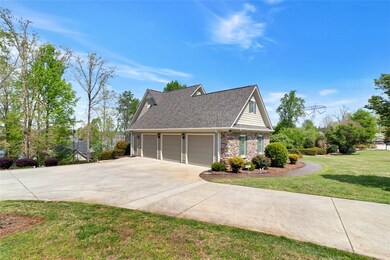 Concrete Drive Leads To Attached 3-Car Garage