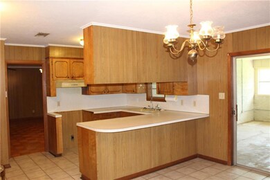 Kitchen with a view of part of the enclosed patio