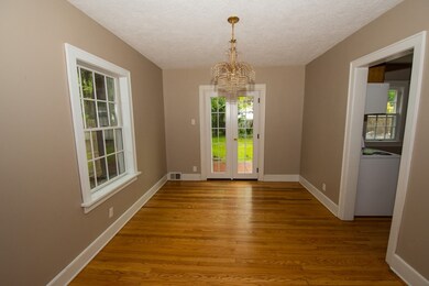 Dining Room with french doors leading to Patio.