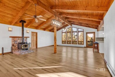 Spacious great room with wood stove