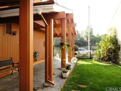 Gated walkway leading to front door.