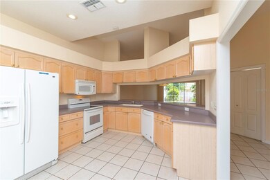 Large kitchen with eat in area.