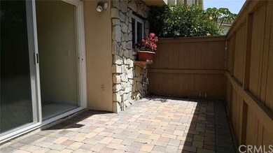 Enclosed, private front patio with pavers and gate