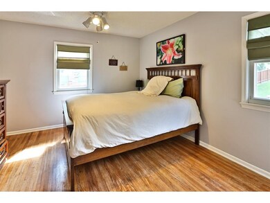 Large Main Floor Bedroom with Hardwood Flooring