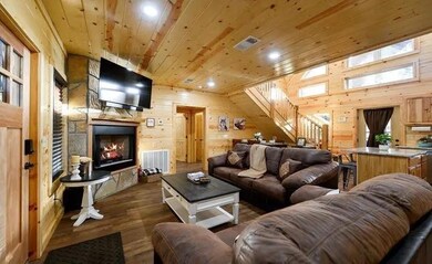 Living room featuring wood walls, wood ceiling, an