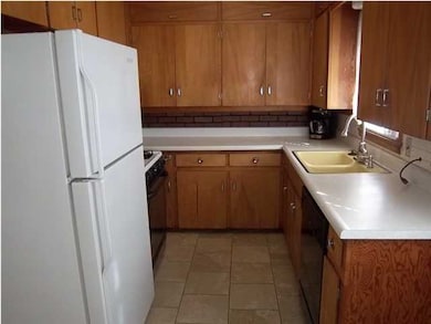 This kitchen has lots of work area and cabinet sto