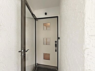 NEW modern, energy efficient front door (with full-view glass storm door).