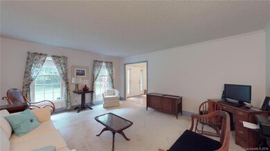 Formal living room is to the right as you enter.  Could be a great home office, home school room, play room, lots of natural light and possibilities.