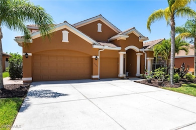Mediterranean / spanish-style home with an attache