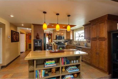 Custom island with butcher block counter and stora