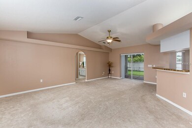 Open living and dining space opening to kitchen an