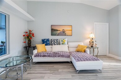 Living room with lofted ceiling and light wood-typ