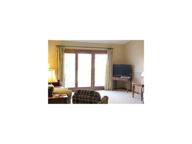 Living Room. This living room boasts vaulted ceili