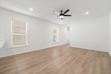 The main living area is spacious. Two windows fill
