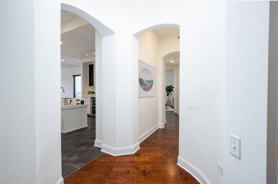 Hallway featuring dark hardwood / wood-style floor