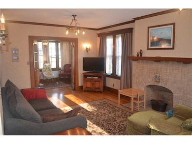 Living Room. Notice beautiful all season room!