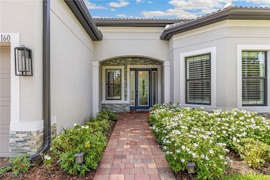 Custom Stonework, Upgraded Front Door with Sidelights, Storm Screen for Front Entry Protection