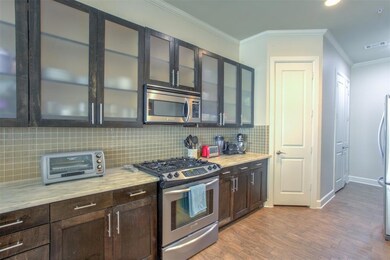The frosted glass front cabinets let some of the p