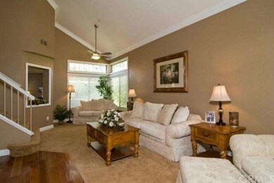 Living Room/Dining Room combo with neutral carpet 