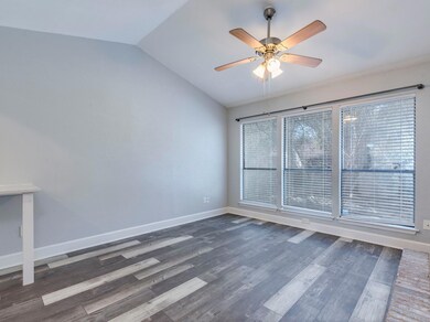 Unfurnished room with lofted ceiling, ceiling fan