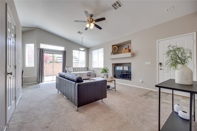 Living area featuring light colored carpet, lofted