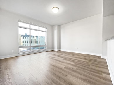 Empty room with wood finished floors and baseboar