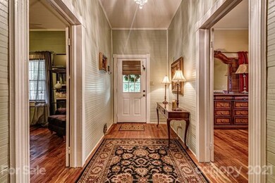 Front door entry to Foyer Wide and Tall ceilings