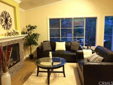 Stone fireplace, open floor plan living room, lots