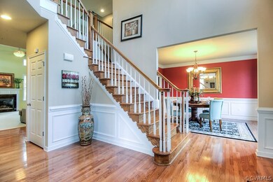 Open 2 Story Chandelier Lit Foyer invites you in t