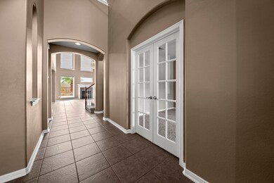 Large entry way with high ceilings, the tile cool