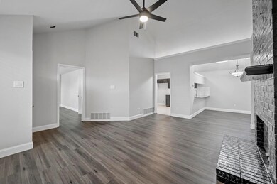 Living room featuring a fireplace, dark hardwood /