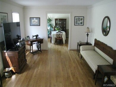 Formal Living Room with Hardwood Flooring and Crow