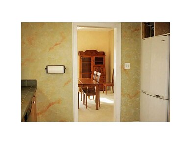 Kitchen. View of formal dining room