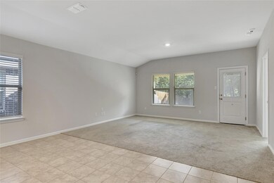 Living room with vaulted ceiling and light colored