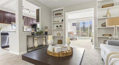 Living room with track lighting and carpet flooring