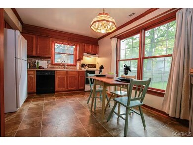 Eat-in kitchen with new vinyl floor and crown mold
